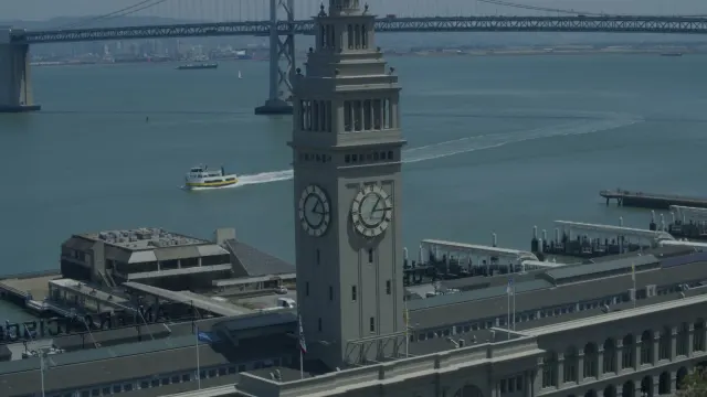 Ferry Building and San Francisco Bay with Moving Ferry Boat