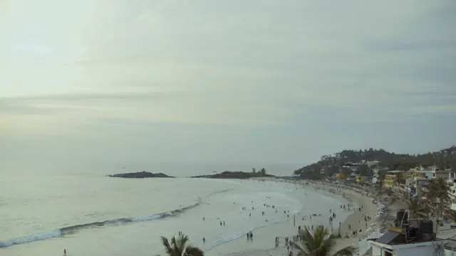Hawa Beach, Kovalam: Kerala Coastline View with Swimmers & Lighthouse