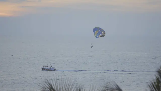 Parasailing Thrills Over Hawa Beach, Kerala, India at Dusk