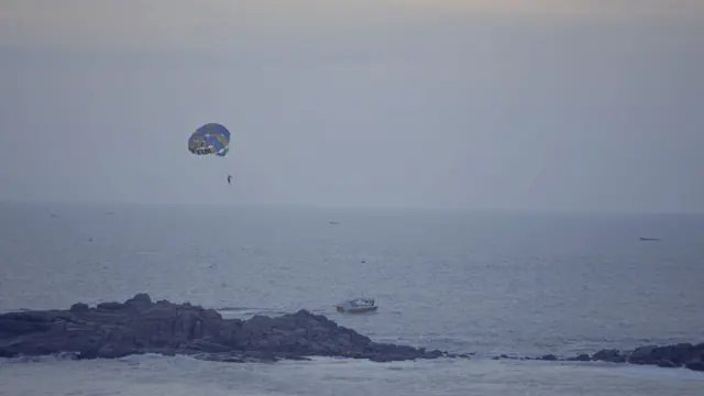 Dusk Parasailing over Arabian Sea, Hawa Beach, Kerala, India
